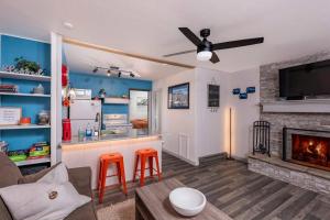 a living room with a couch and a fireplace at Skyes Hideaway Walk to Lifts in Angel Fire