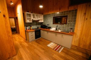 Kuchyň nebo kuchyňský kout v ubytování Warara Malalcahuello