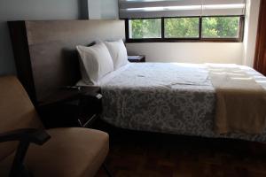 Postel nebo postele na pokoji v ubytování Kunan Hotel