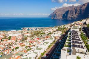 an aerial view of a city and the ocean at SVB Aquasuites Luxury Penthouse - A02 in Santiago del Teide