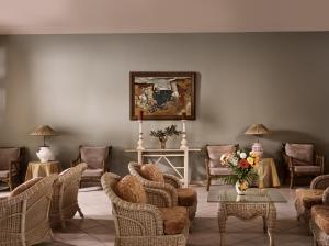 a living room filled with chairs and a table at AQUARIUS HOTEL in Vasilikos