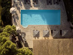 an overhead view of a swimming pool on a building at AQUARIUS HOTEL in Vasilikos