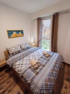 Postel nebo postele na pokoji v ubytování Nikolic 2 Apartmen