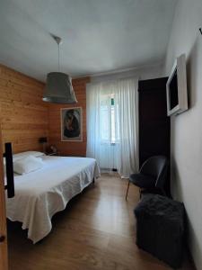 A bed or beds in a room at Piccolo Appartamento Casa Vacanze B&B Angela