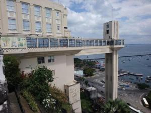 a building with a bridge with a train on top of it at Studio Pelourinho, Salvador in Salvador