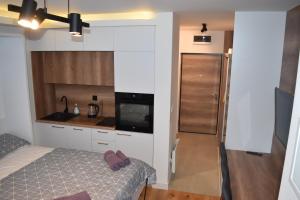 Ένα ή περισσότερα κρεβάτια σε δωμάτιο στο Apartment Delight