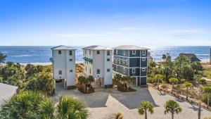 an aerial view of a house with the ocean in the background at Pet Friendly Beach House - Starfish by Panhandle Getaways in Indian Pass