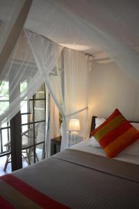 Katil atau katil-katil dalam bilik di Dunes Unawatuna Hotel
