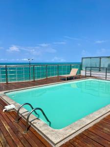 a swimming pool on the deck of a cruise ship at APART HOTEL MANAIRA PALACe 2 in João Pessoa