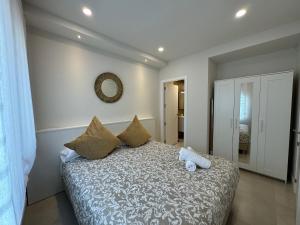 Postel nebo postele na pokoji v ubytování Apartamentos Las Acacias