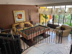 Un lugar para sentarse en Casa Pino Residencia de Lujo - Alberca con Caldera Incluido