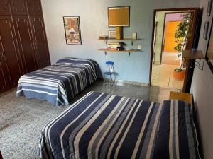 Una cama o camas en una habitación de Casa Pino Residencia de Lujo - Alberca con Caldera Incluido
