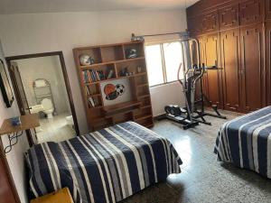 Una cama o camas en una habitación de Casa Pino Residencia de Lujo - Alberca con Caldera Incluido