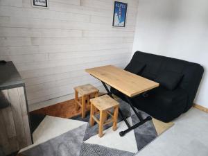 Posezení v ubytování studio ski aux pieds avec parking couvert + 5 fotografií