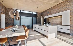 a kitchen and dining room with a table and chairs at Gorgeous Home In Ebeltoft With Kitchen in Ebeltoft