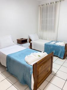Postel nebo postele na pokoji v ubytování Pousada da Orla