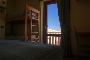Postel nebo postele na pokoji v ubytování BiancaNeve B&B