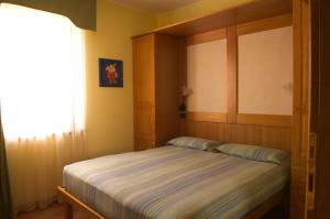 Postel nebo postele na pokoji v ubytování BiancaNeve B&B