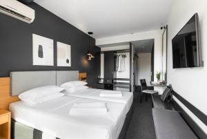Postel nebo postele na pokoji v ubytování Park Hotel