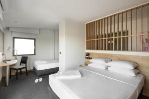 Postel nebo postele na pokoji v ubytování Park Hotel