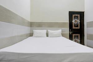 Postel nebo postele na pokoji v ubytování Hotel O YOUR RESIDENCY