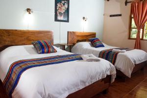 Ein Bett oder Betten in einem Zimmer der Unterkunft Rio Quijos EcoLodge