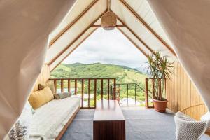 a living room with a couch and a table at Alas Romantic Chalet Monteverde in Monteverde Costa Rica