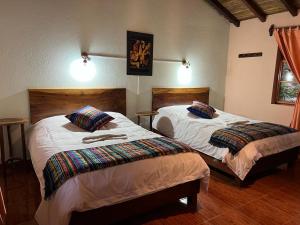 Ein Bett oder Betten in einem Zimmer der Unterkunft Rio Quijos EcoLodge