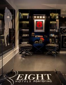 a dressing room with a display case with toilets portfolios at Eight Hotel Portofino in Portofino