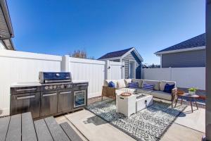a patio with a stove and a couch and a grill at Hot Tub, Heber Home, Pet-Friendly, Games, Sleeps 13 Guest! in Heber City