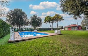 an image of a swimming pool in a yard at 3 Bedroom Nice Home In Rosolina in Rosolina +29 photos