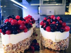 two pieces of cake with berries on top of it at B&B Villa Maria Pia in Monopoli