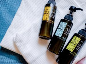 two bottles of essential oils sitting on a napkin at Hotel Areaone Naruto in Naruto +17 photos