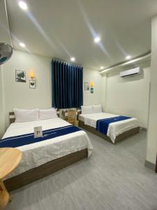 Giường trong phòng chung tại Hana motel