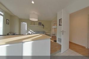 a kitchen and living room with a counter top in a room at 3 bedrooms-Very bright and spacious appt- wifi in Toulon