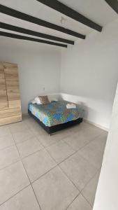 a bedroom with a bed in the corner of a room at Casa La Eliana in Salento +53 photos