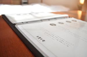 a tablet sitting on top of a wooden table at 三笠の宿 Mikasanoyado in Kiso