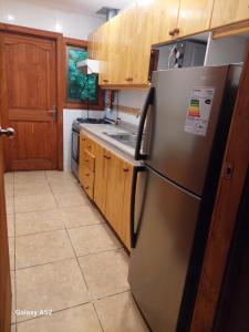 Η κουζίνα ή μικρή κουζίνα στο Cabañas privadas Pucon +3 φωτογραφίες