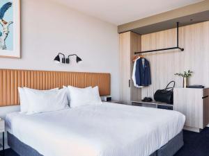 Postel nebo postele na pokoji v ubytování Mantra Melbourne Epping