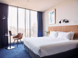 Postel nebo postele na pokoji v ubytování Mantra Melbourne Epping