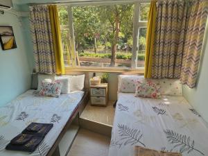 Voodi või voodid majutusasutuse AMU Dreamhouse 阿木旅舍 toas