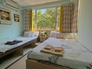 Voodi või voodid majutusasutuse AMU Dreamhouse 阿木旅舍 toas