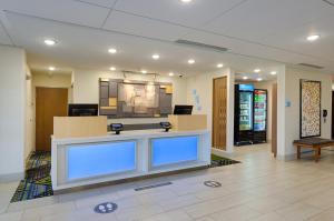 a waiting area in a hospital with blue lights at Holiday Inn Express & Suites - Abingdon by IHG in Abingdon