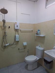 a bathroom with a toilet and a sink at The Rock Coco Villa in Ban Laem Pom +35 photos