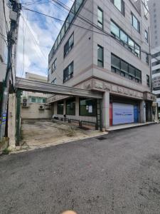an empty street in front of a building at Hongdae Main Street Unique Interior, Spacious Room in Seoul
