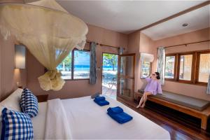 Postel nebo postele na pokoji v ubytování Mayalay Resort-Green Hotel