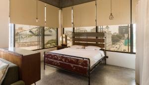 Postel nebo postele na pokoji v ubytování Belakang Kong Heng Ipoh Hotel + 37 fotografií