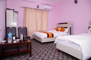 Postel nebo postele na pokoji v ubytování Amazon Resort
