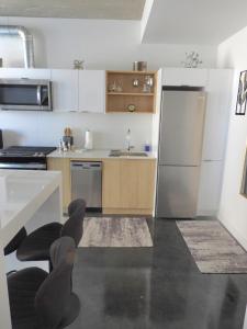 Kuchyň nebo kuchyňský kout v ubytování Modern Cozy Nest