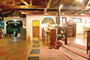 a large room with a kitchen and a table at Oriental Hill Sabang Resort Puerto Galera in Puerto Galera